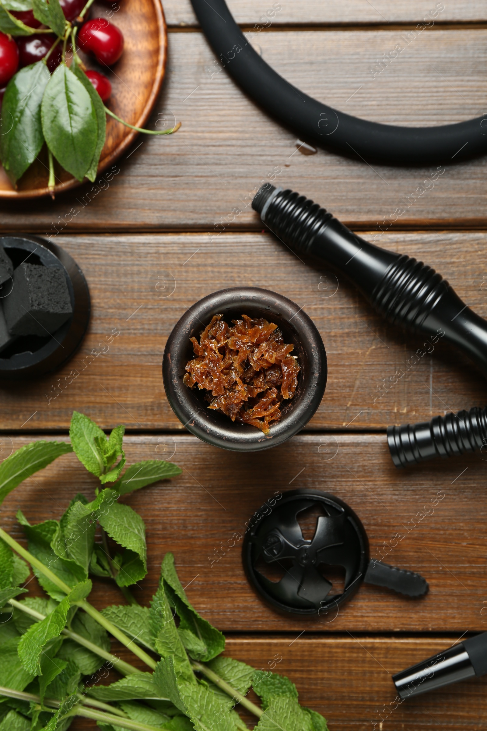 Photo of Flat lay composition with traditional hookah parts on wooden table