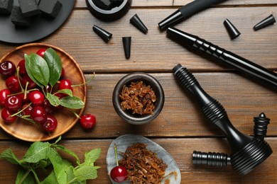Photo of Flat lay composition with traditional hookah parts on wooden table