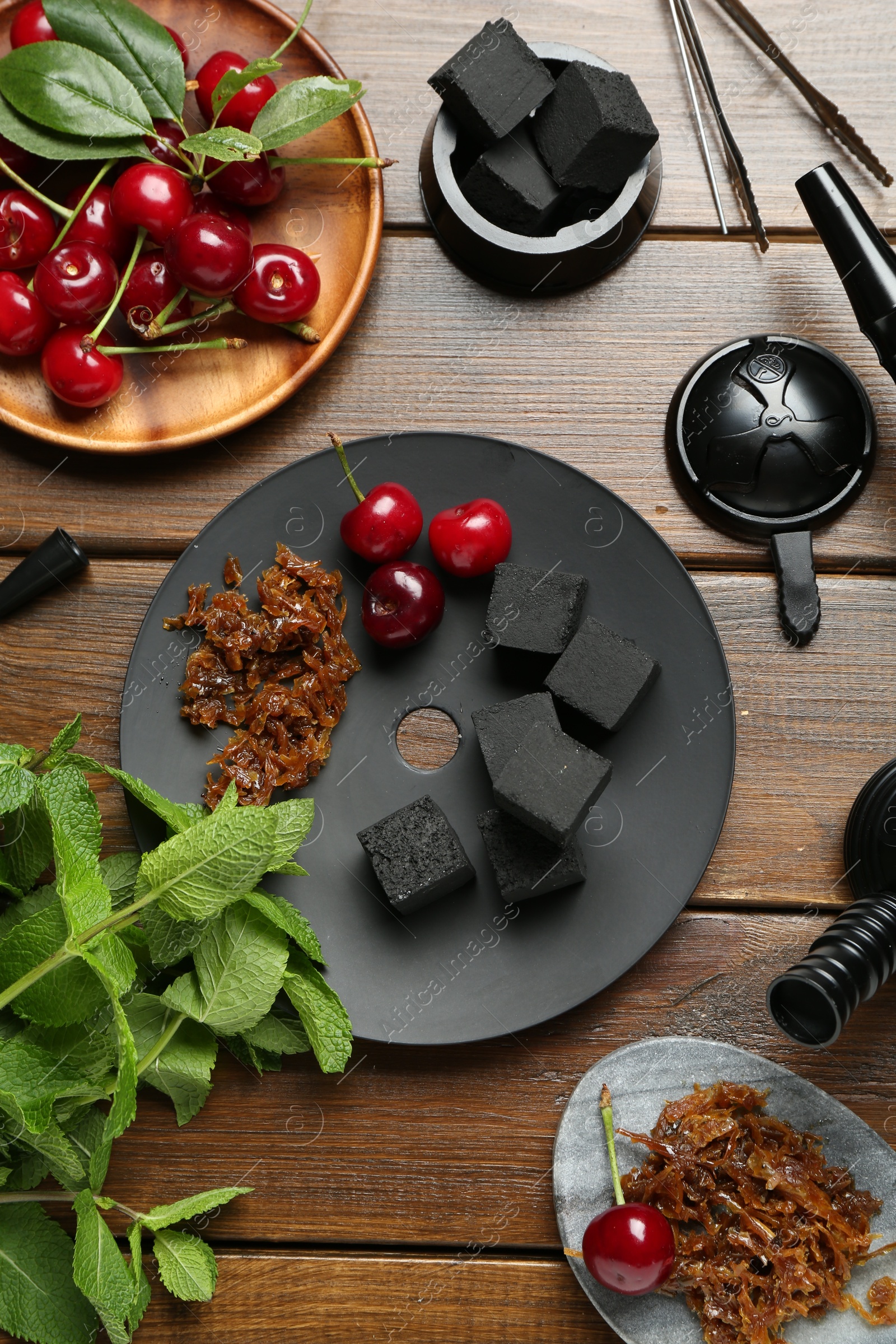 Photo of Flat lay composition with traditional hookah parts on wooden table