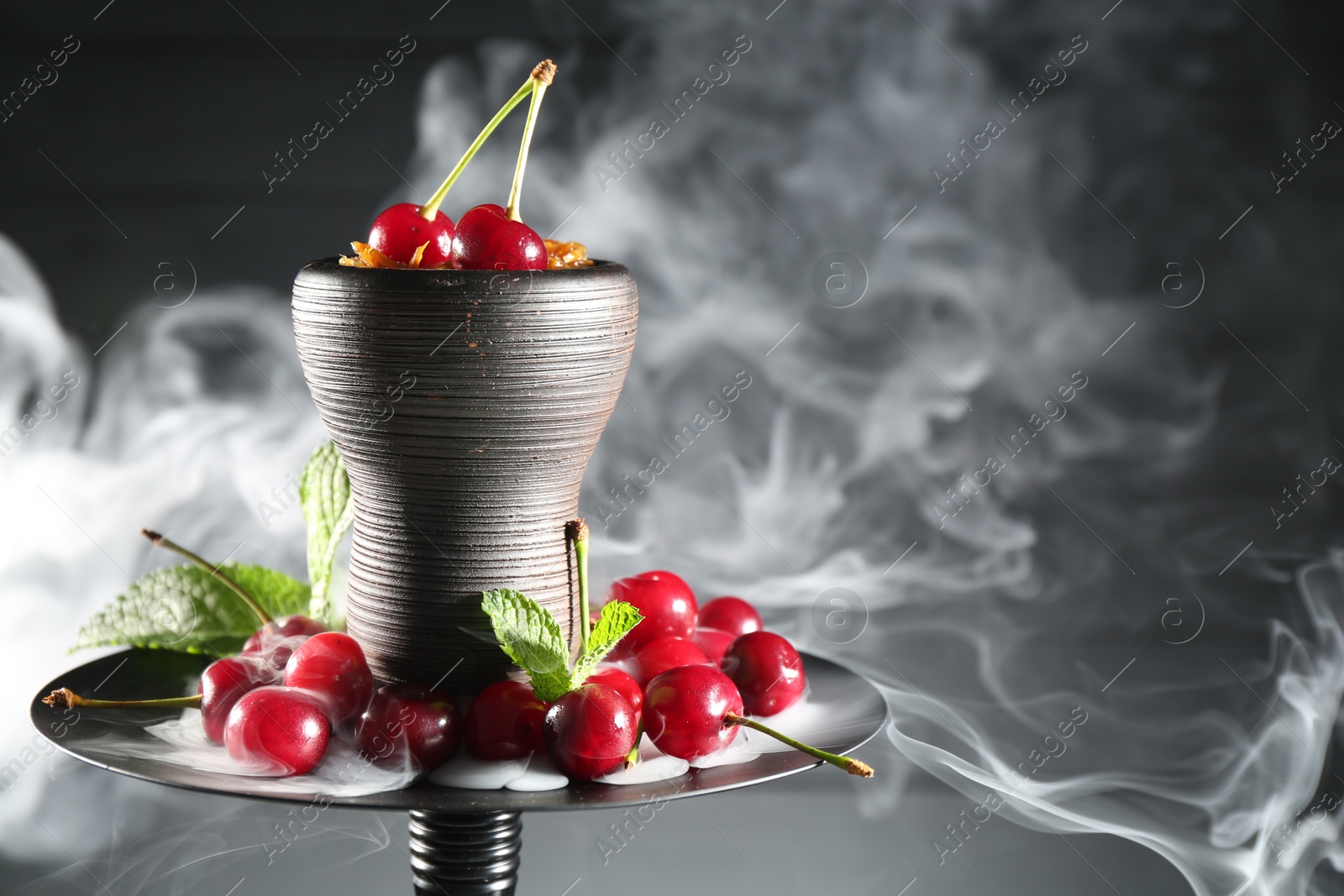 Hookah with cherries and smoke on black background, closeup. Space for text Photo of Hookah with cherries and smoke on black background, closeup. Space for text