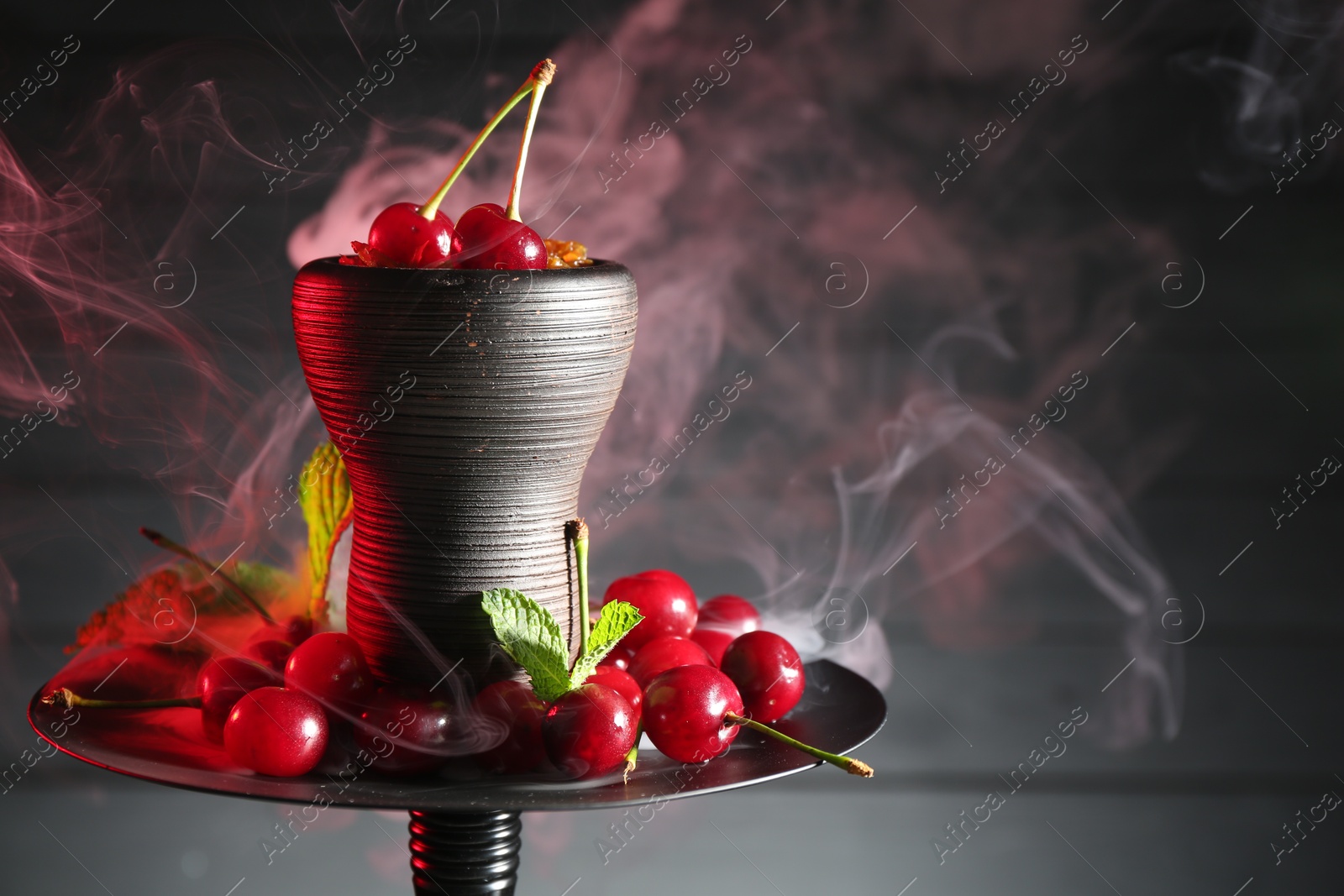 Hookah with cherries and smoke on black background, closeup. Space for text Photo of Hookah with cherries and smoke on black background, closeup. Space for text