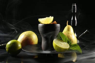 Photo of Hookah bowl with fruits, mint and smoke on black table, closeup