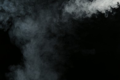 Photo of Hookah smoke on black background, closeup. Space for text