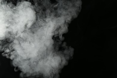Photo of Hookah smoke on black background, closeup. Space for text