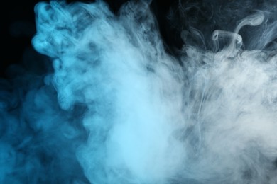 Photo of Beautiful hookah smoke on black background, closeup