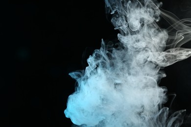 Photo of Hookah smoke on black background, closeup. Space for text