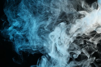 Photo of Beautiful hookah smoke on black background, closeup