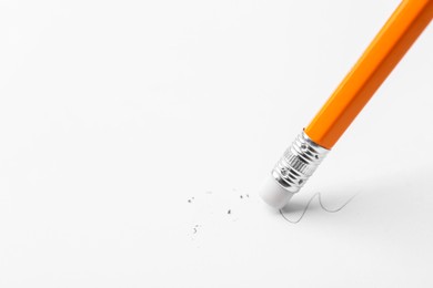 Photo of Using pencil with eraser on white background, closeup. Space for text