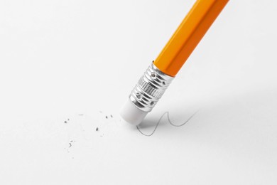 Photo of Using pencil with eraser on white background, closeup