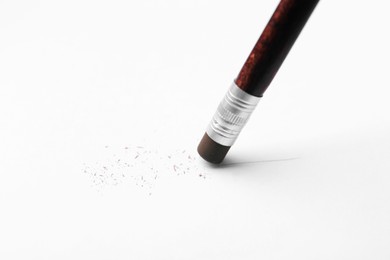 Photo of Using pencil with eraser on white background, closeup