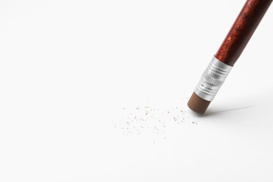 Photo of Using pencil with eraser on white background, closeup. Space for text