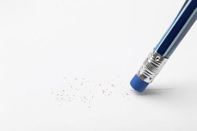 Photo of Using pencil with eraser on white background, closeup. Space for text