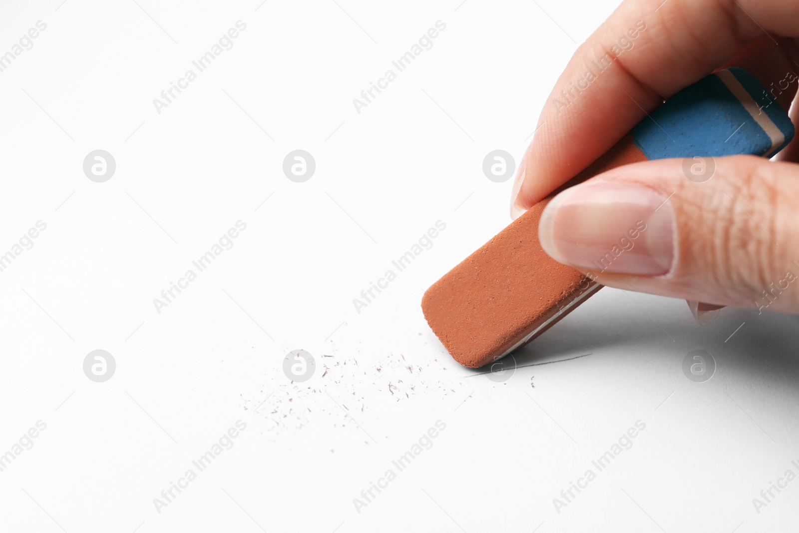 Woman using eraser at white paper, closeup. Space for text Photo of Woman using eraser at white paper, closeup. Space for text