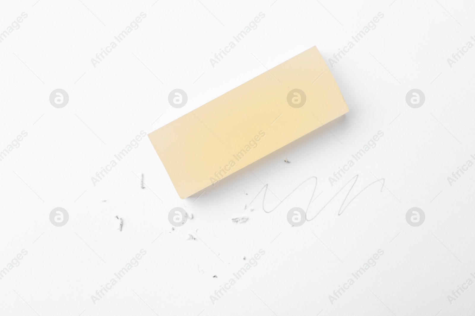 Eraser, doodle and scraps on white background, top view Photo of Eraser, doodle and scraps on white background, top view