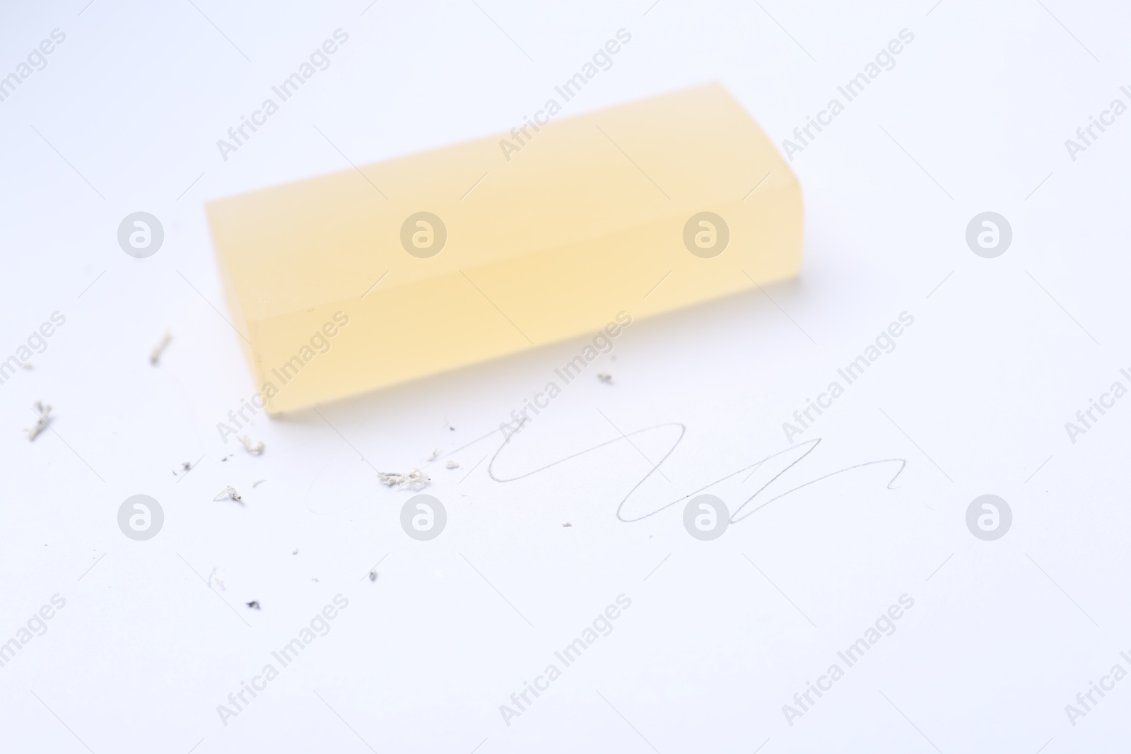 Eraser, doodle and scraps on white background, selective focus Photo of Eraser, doodle and scraps on white background, selective focus