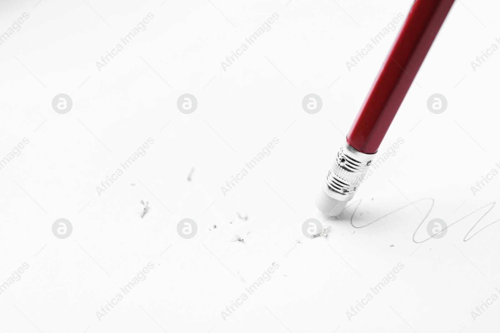Using pencil with eraser on white background, closeup. Space for text Photo of Using pencil with eraser on white background, closeup. Space for text