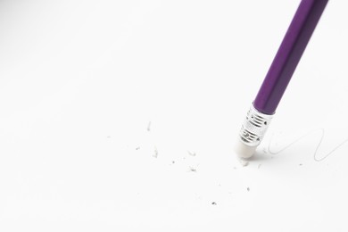 Photo of Using pencil with eraser on white background, closeup. Space for text