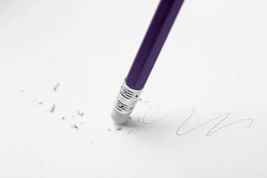 Photo of Using pencil with eraser on white background, closeup