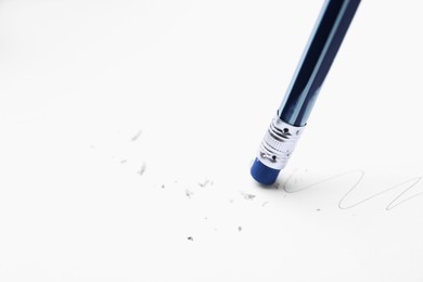Photo of Using pencil with eraser on white background, closeup. Space for text