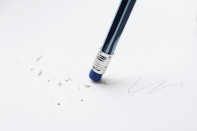 Photo of Using pencil with eraser on white background, closeup