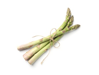 Photo of Fresh ripe raw asparagus isolated on white, top view