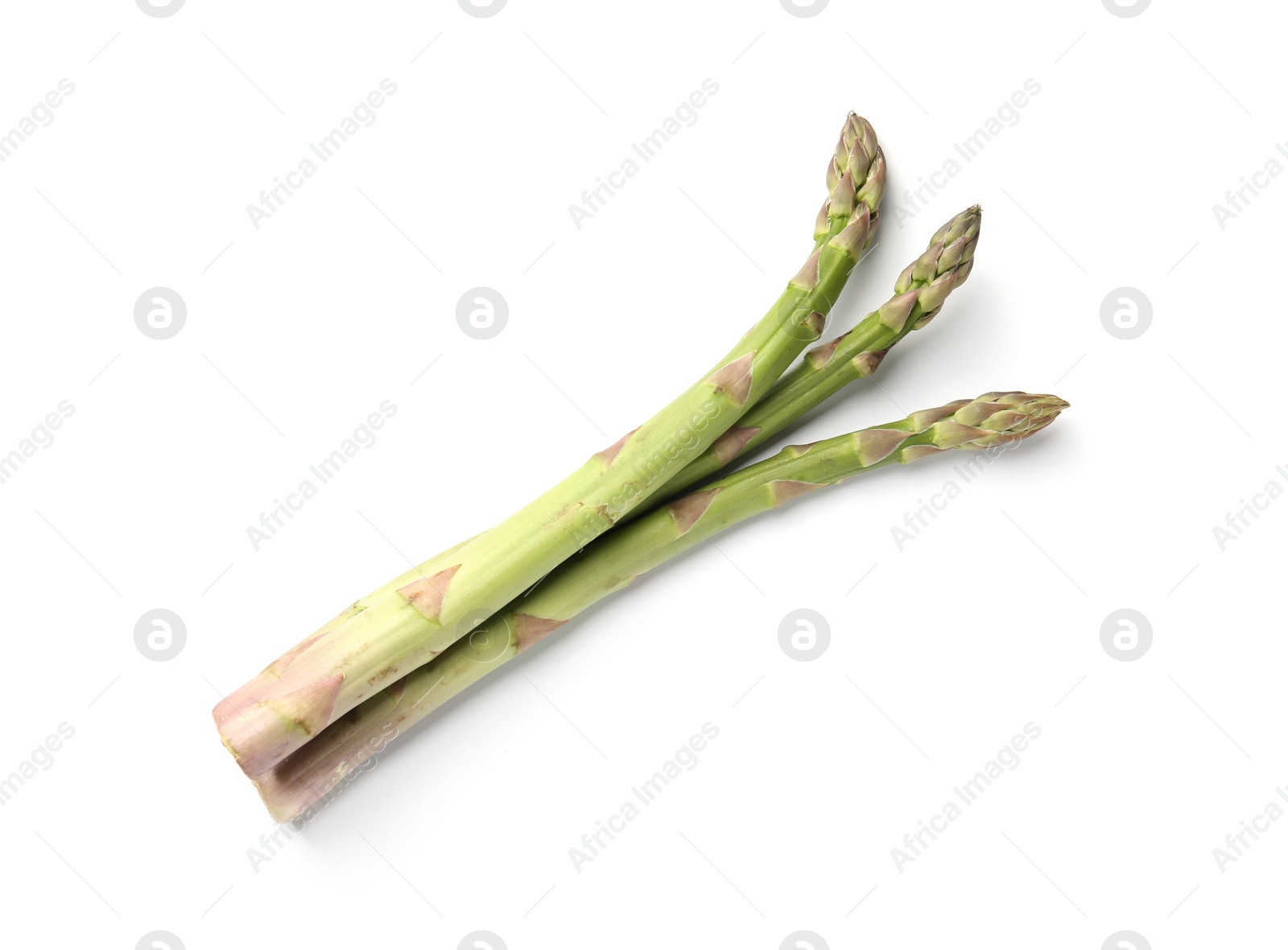 Photo of Fresh ripe raw asparagus isolated on white, top view