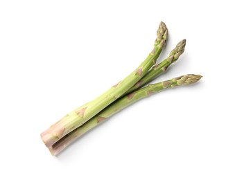 Photo of Fresh ripe raw asparagus isolated on white, top view