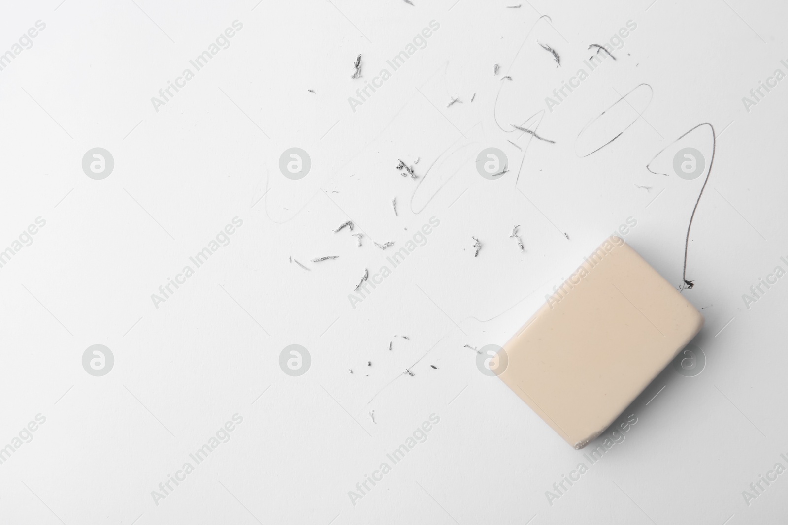 Eraser on paper sheet with pencil strokes, top view Photo of Eraser on paper sheet with pencil strokes, top view