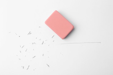 Photo of Eraser on paper sheet with pencil strokes, top view