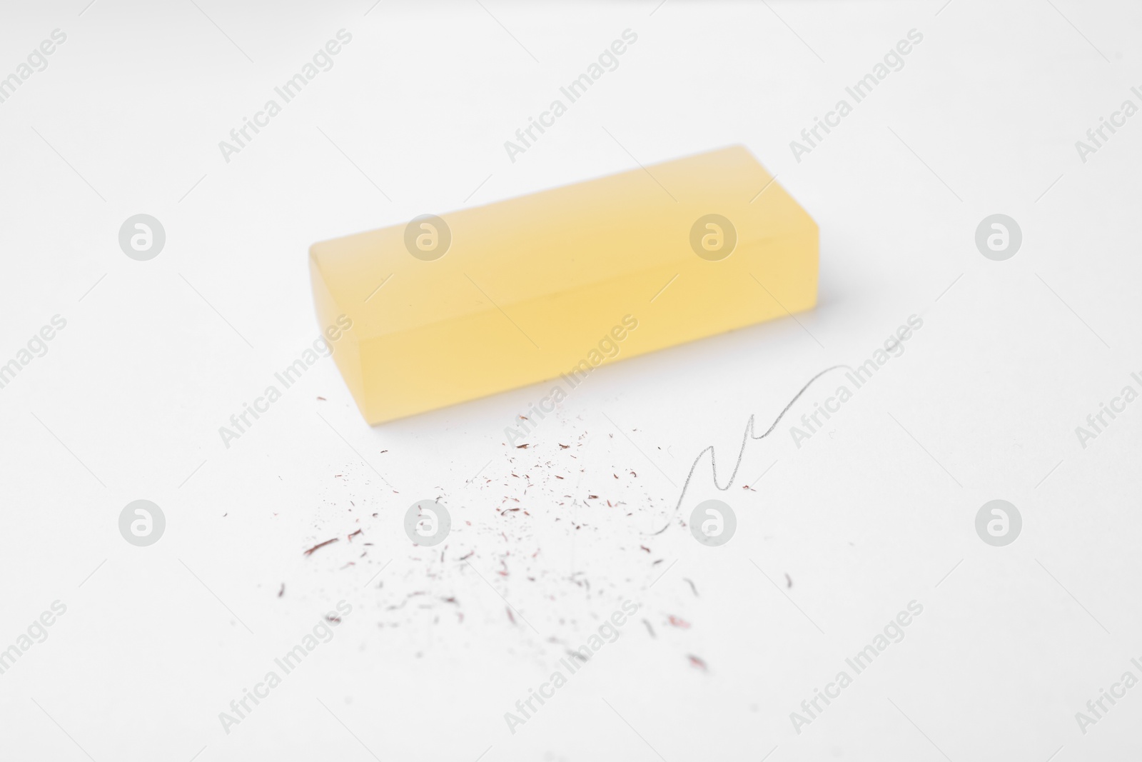 Eraser on paper sheet with pencil strokes, closeup Photo of Eraser on paper sheet with pencil strokes, closeup