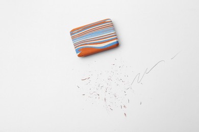 Photo of Eraser on paper sheet with pencil strokes, top view