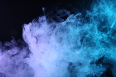 Photo of Hookah smoke in color lights on black background, closeup