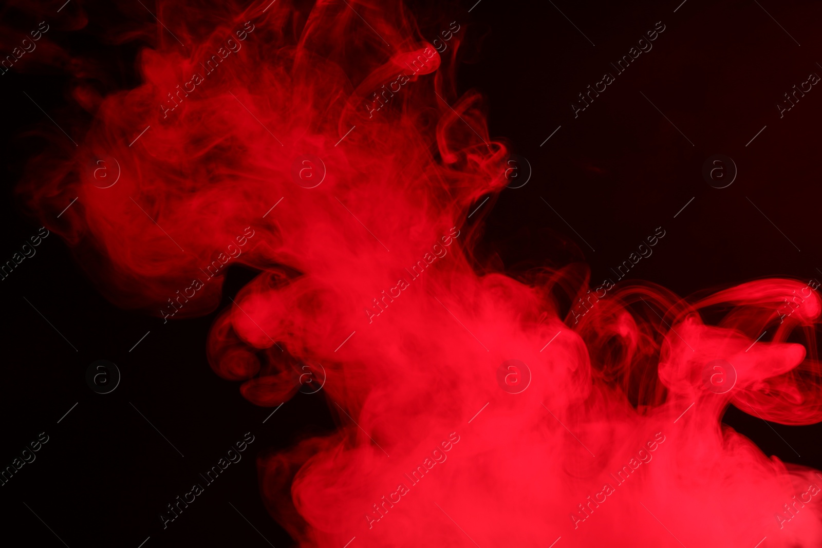 Photo of Hookah smoke in red light on black background, closeup