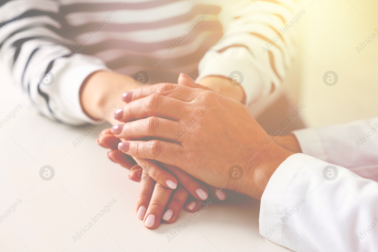 Psychologist supporting client during therapy indoors, closeup Image of Psychologist supporting client during therapy indoors, closeup