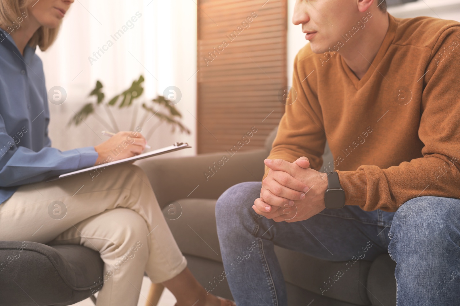 Psychologist working with client in office, closeup Image of Psychologist working with client in office, closeup