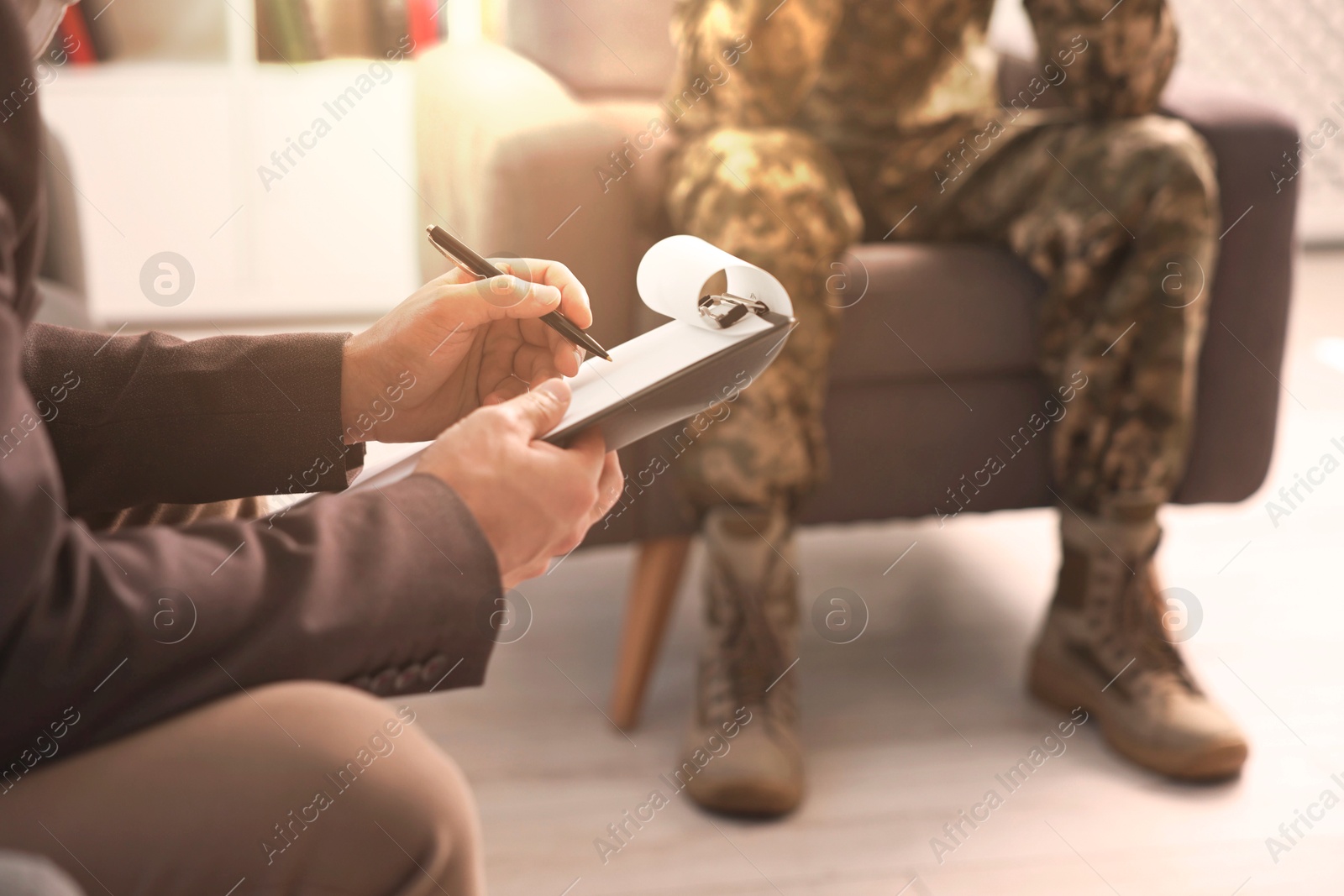 Psychologist working with military man in office, closeup Image of Psychologist working with military man in office, closeup