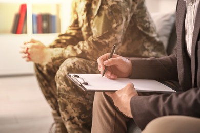 Image of Psychologist working with military man in office, closeup