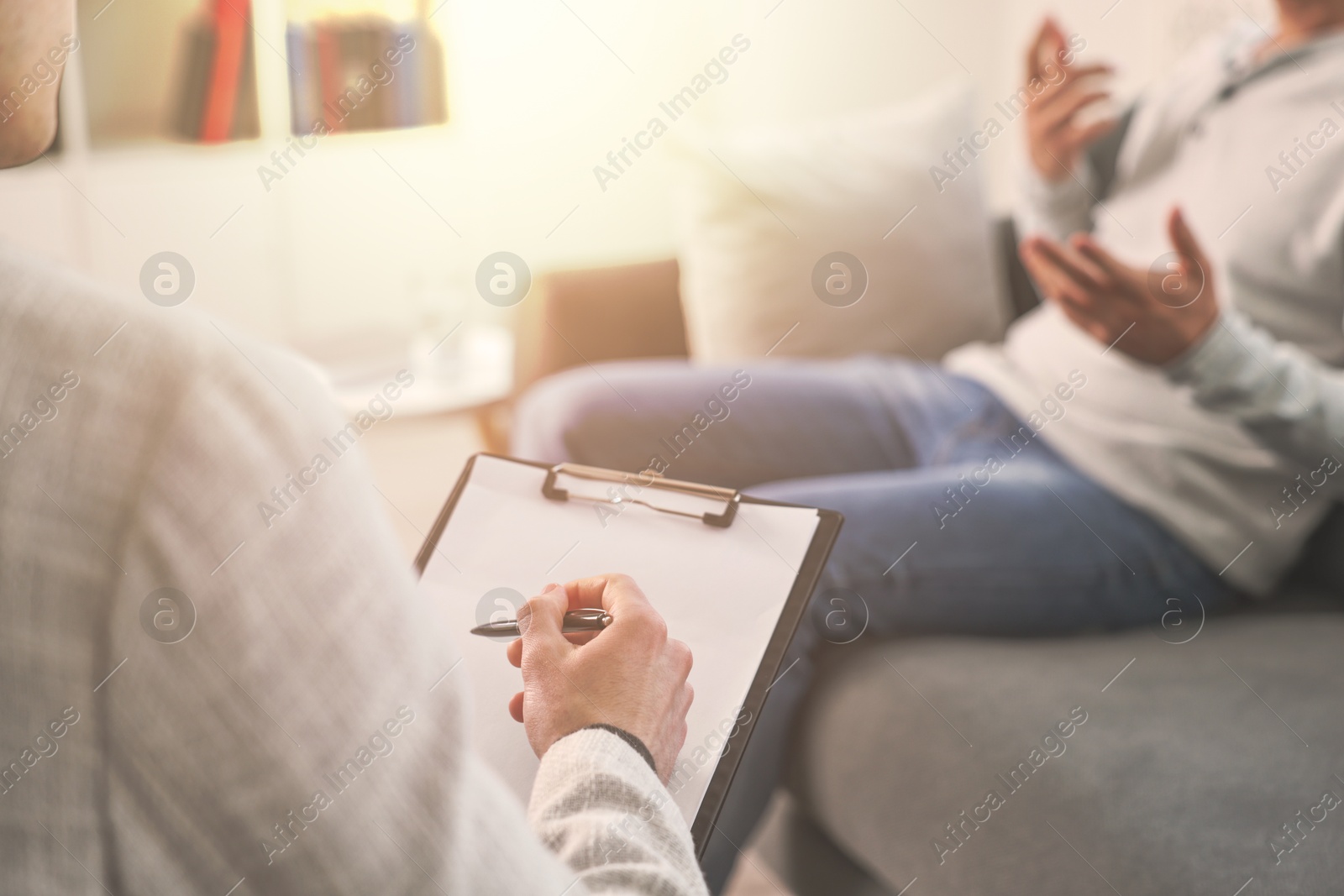 Psychologist working with client in office, closeup Image of Psychologist working with client in office, closeup