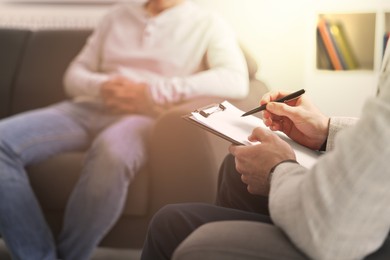 Image of Psychologist working with client in office, closeup