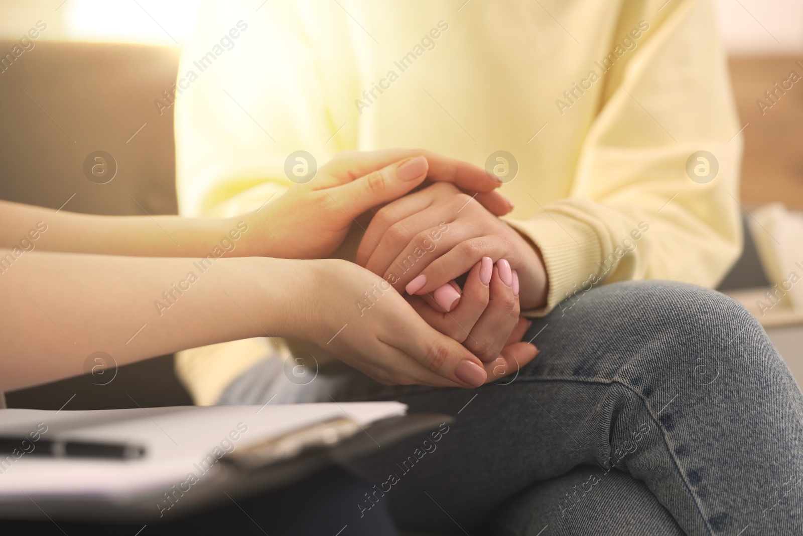 Psychologist supporting client during therapy in office, closeup Image of Psychologist supporting client during therapy in office, closeup