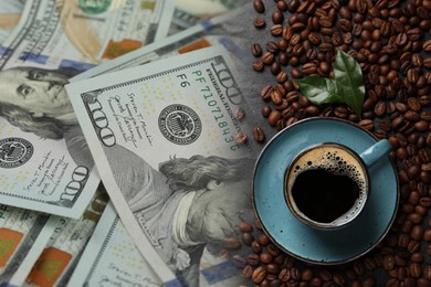 Image of Rising coffee price. Roasted beans, hot drink and dollar bills on grey table, double exposure