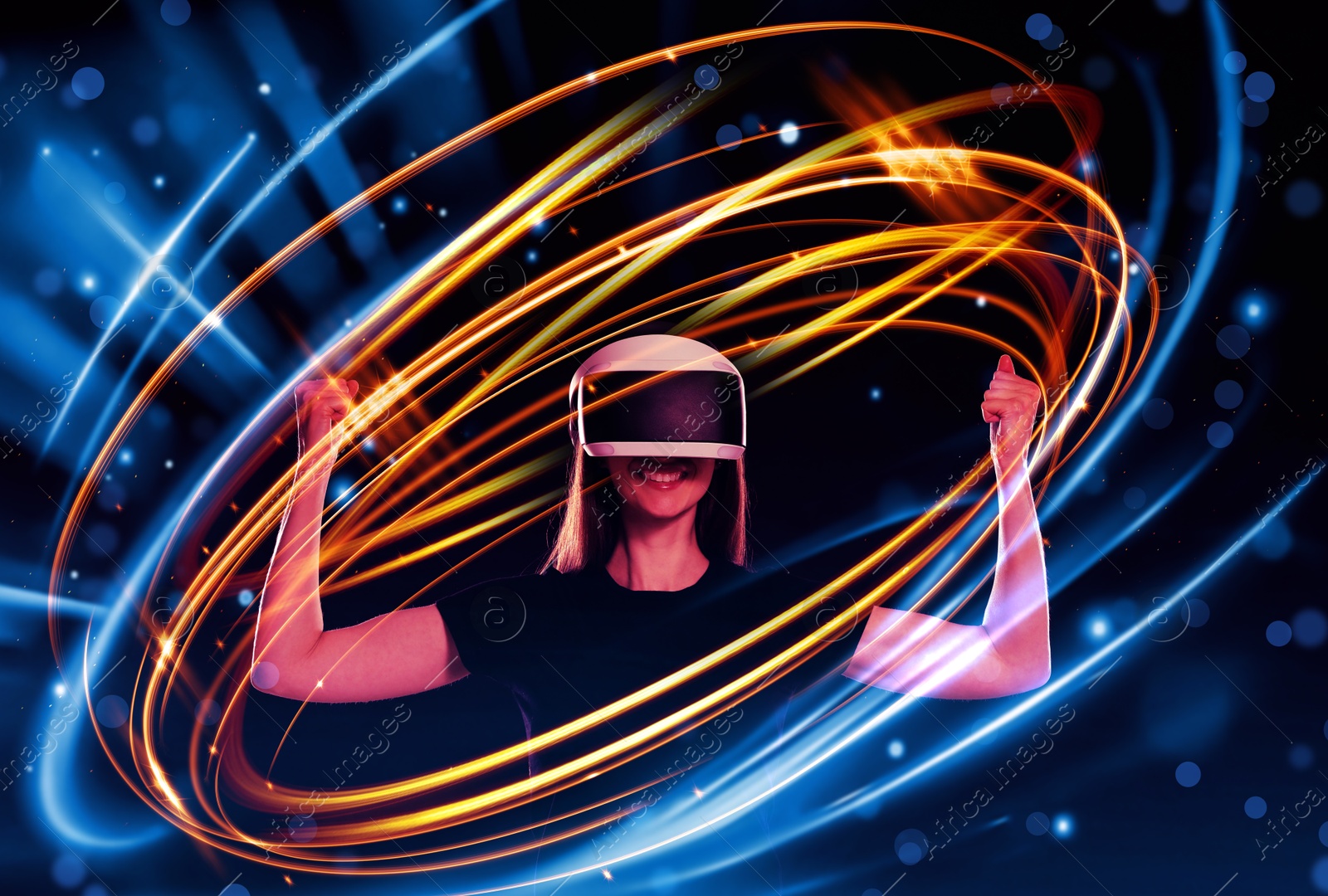 Woman using virtual reality headset on dark blue background. Bright neon lines around her Image of Woman using virtual reality headset on dark blue background. Bright neon lines around her
