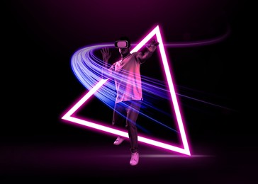 Image of Man using virtual reality headset on dark background. Bright neon lines around him