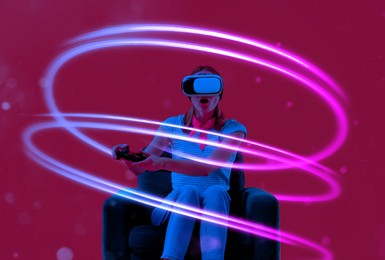 Image of Woman using virtual reality headset and controller in armchair on crimson color background. Bright neon lines around her