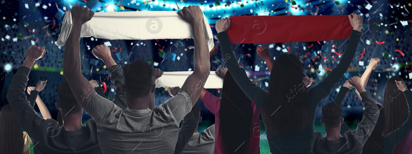 Excited fans celebrating victory in spectator area under falling confetti at stadium, back view Image of Excited fans celebrating victory in spectator area under falling confetti at stadium, back view