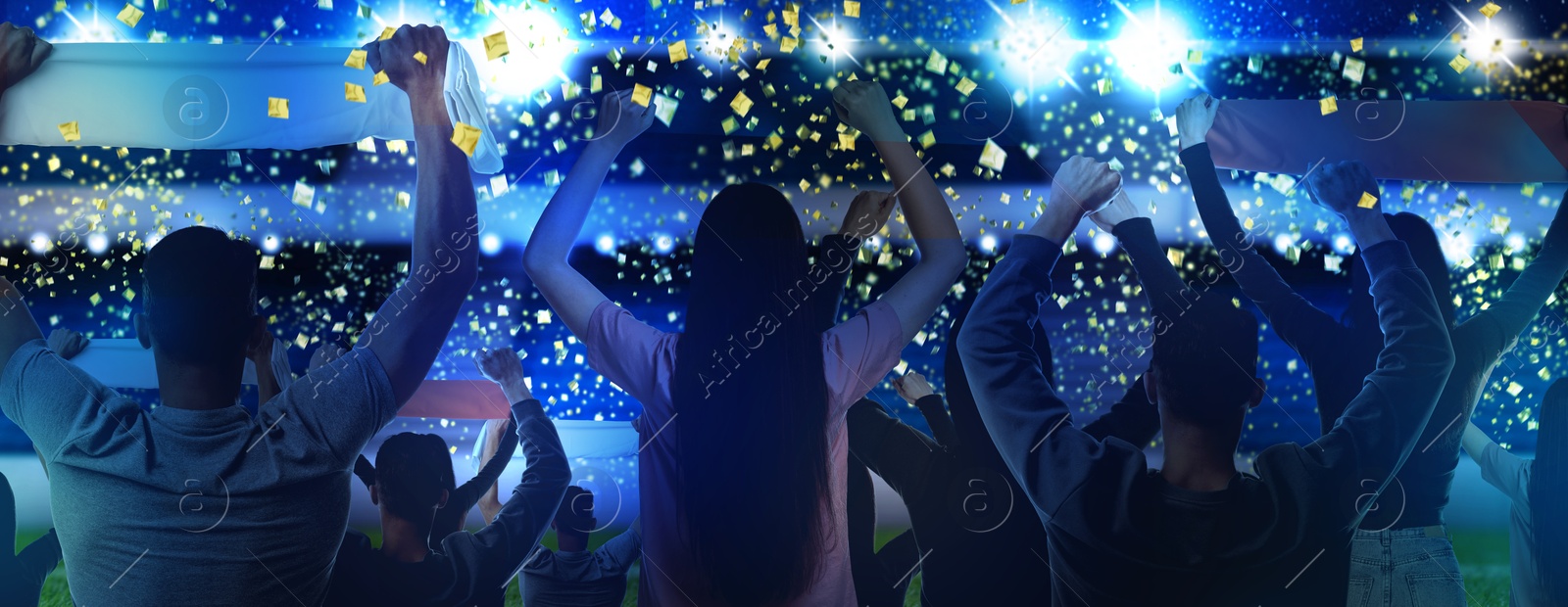 Excited fans celebrating victory in spectator area under falling confetti at stadium, back view Image of Excited fans celebrating victory in spectator area under falling confetti at stadium, back view