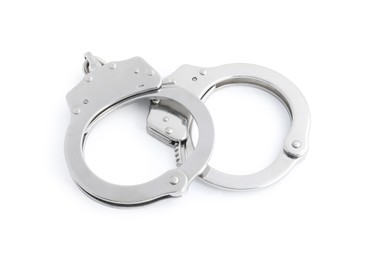 Photo of Handcuffs on white background, above view. Police equipment