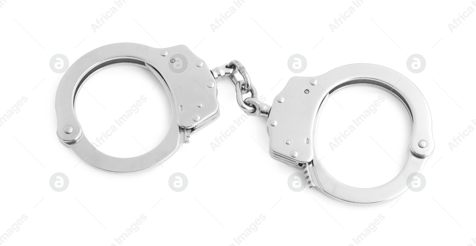 Handcuffs on white background, top view. Police equipment Photo of Handcuffs on white background, top view. Police equipment