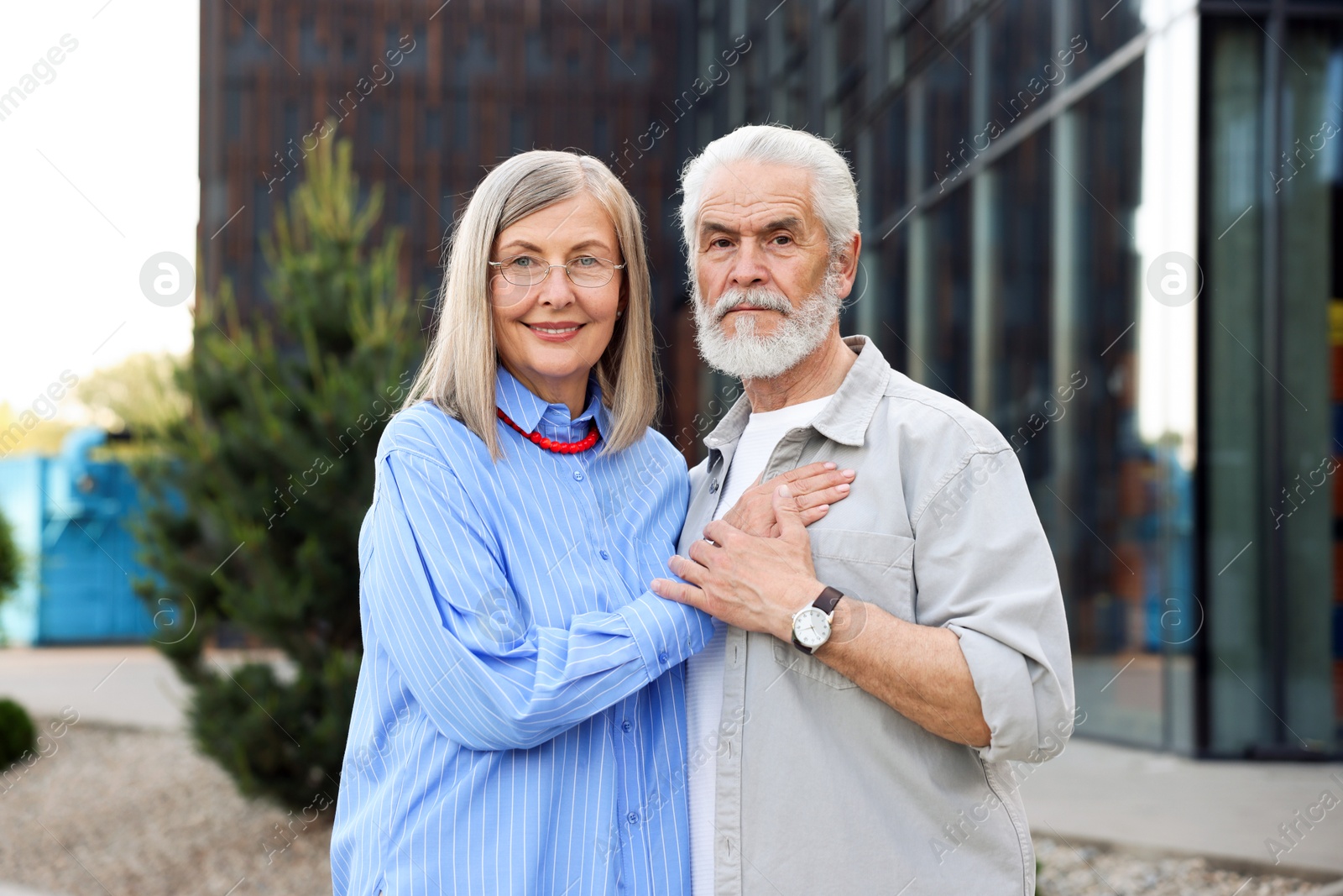 Lovely senior couple walking together in park Photo of Lovely senior couple walking together in park
