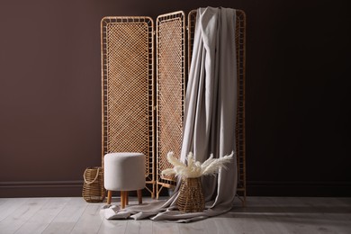 Photo of Photo zone with stylish folding screen in studio
